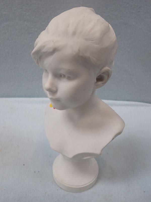 A PARIAN WARE BUST OF A YOUNG BOY