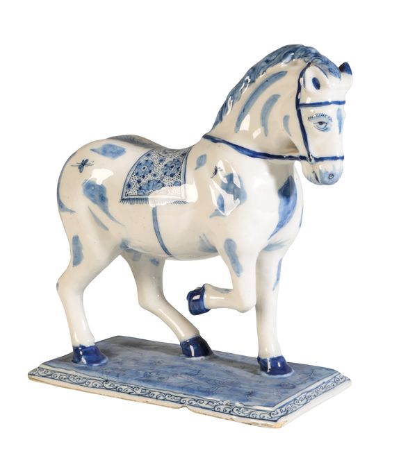 A DELFT BLUE AND WHITE MODEL OF A PRANCING HORSE