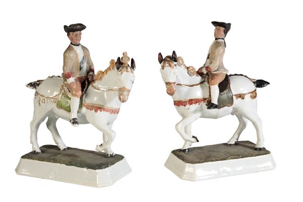 A PAIR OF DELFT POLYCHROME MODELS OF EQUESTRIANS