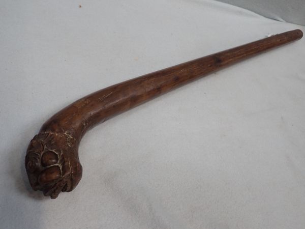 A TRIBAL WOODEN CLUB