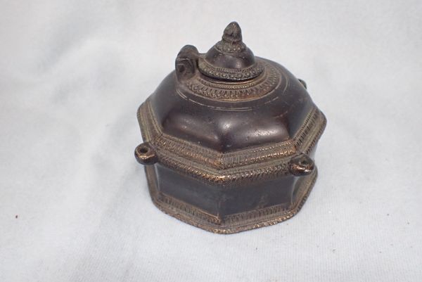 AN ASIAN CAST BRONZE CENSER OF DOMED OCTAGONAL FORM