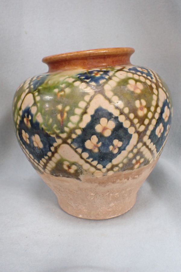 AN ORIENTAL GLAZED POTTERY VASE