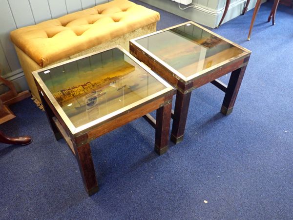 A PAIR OF TEAK AND BRASS BOUND TABLES