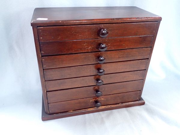 AN EARLY 20TH CENTURY STAINED PINE COLLECTOR'S CABINET