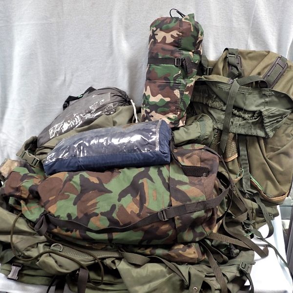 A COLLECTION OF CAMOUFLAGE CAMPING GEAR