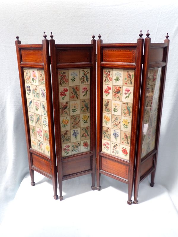 AN EDWARDIAN MAHOGANY FOUR-FOLD FIRESCREEN