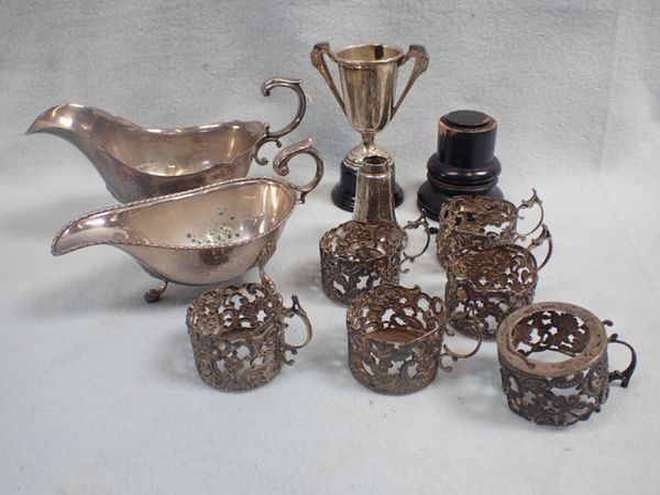 A SET OF SIX SILVER COFFEE CAN OR DEMITASSE HOLDERS