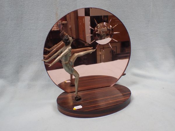 AN ART DECO CLOCK WITH CAST METAL DANCING GIRL FIGURE