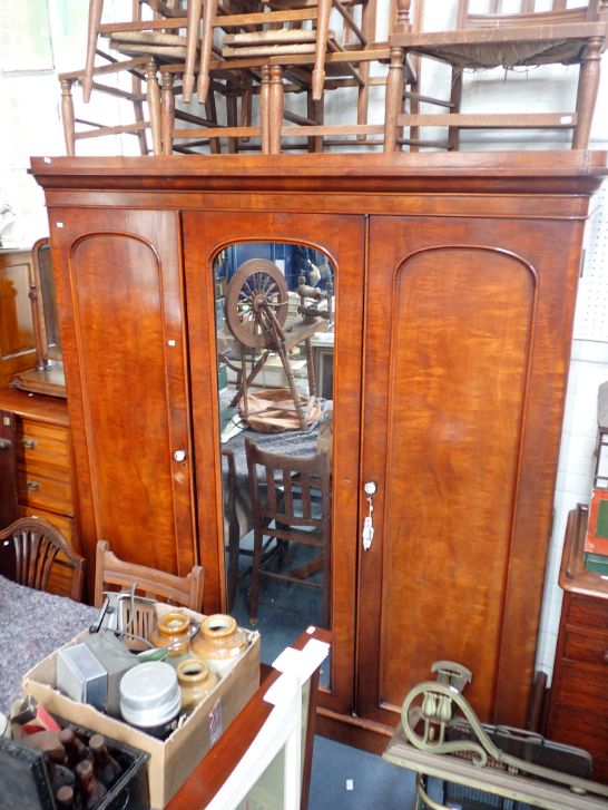 A MID 19TH CENTURY MAHOGANY TRIPLE WARDROBE