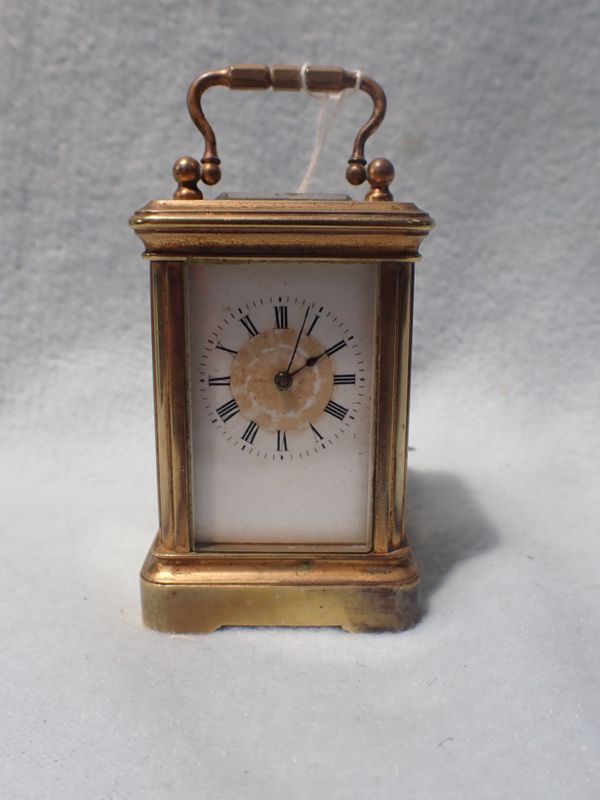 A MINIATURE CARRIAGE CLOCK