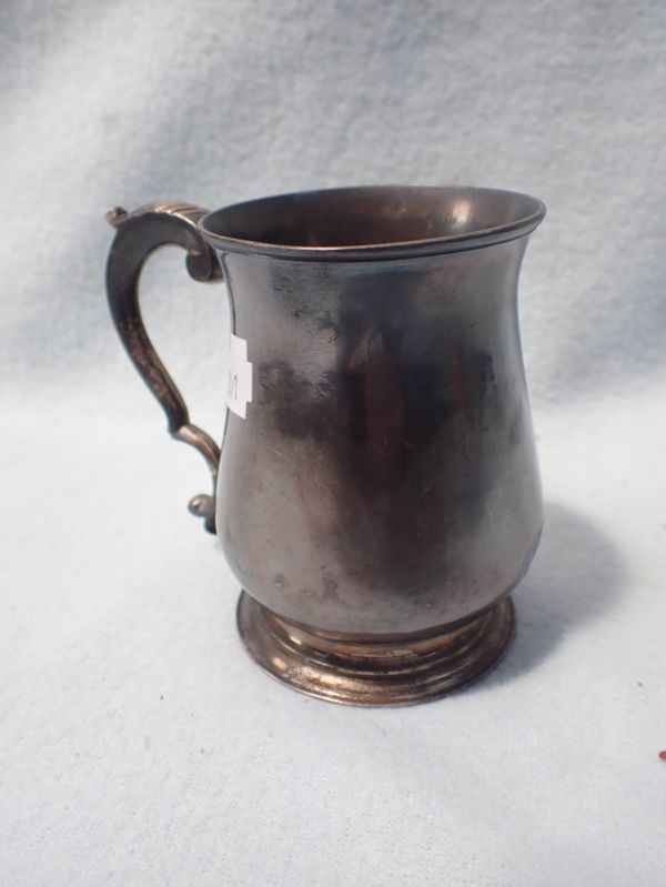 A SILVER MUG, WITH SCROLLED HANDLE