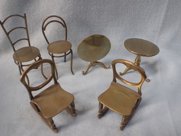 A COLLECTION OF MINIATURE BRASS FURNITURE