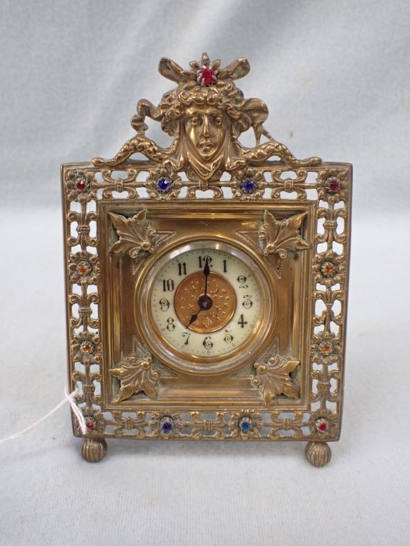 A VICTORIAN EASEL FRAMED CLOCK