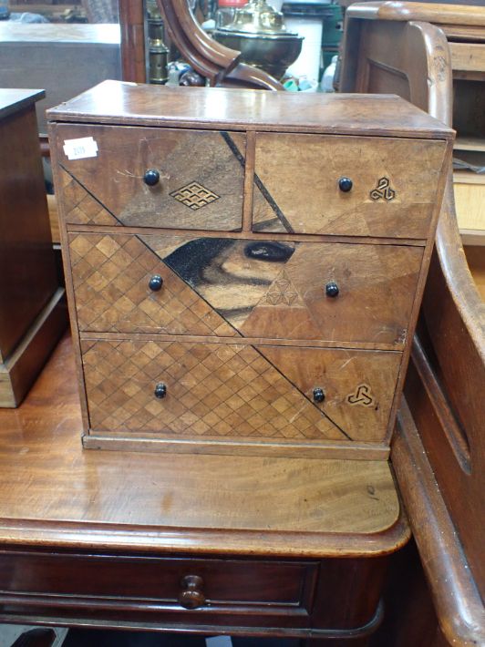 A SMALL JAPANESE PARQUETRY CHEST OF DRAWERS