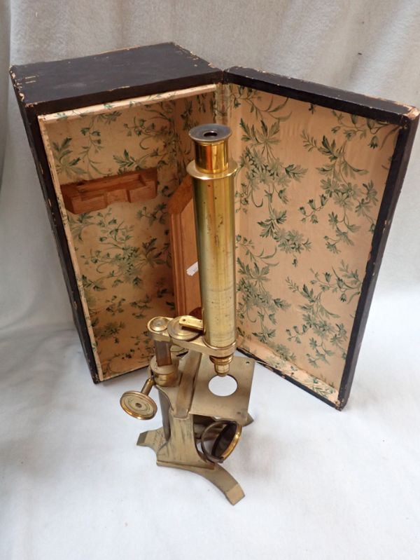 A 19TH CENTURY MONOCULAR MICROSCOPE BY BAKER