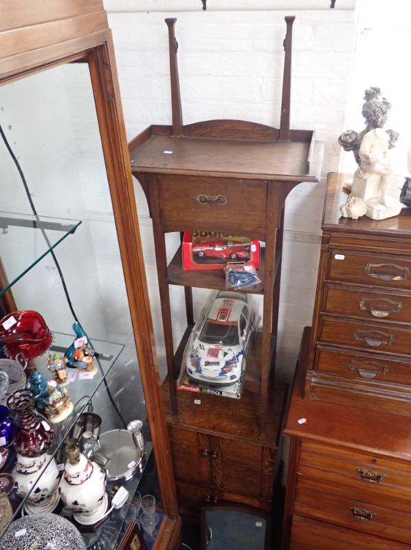 AN OAK BEDSIDE CUPBOARD