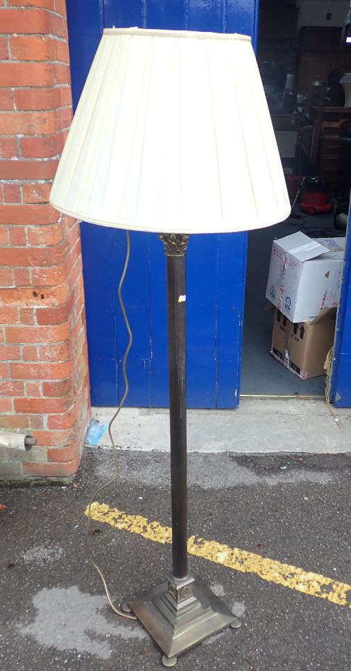 A BRASS PILLAR STANDARD LAMP