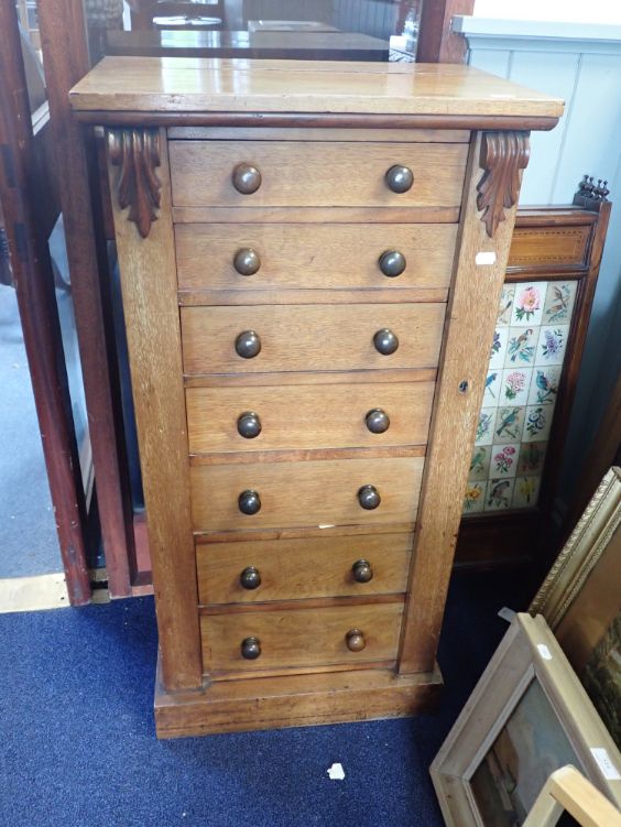 A VICTORIAN ROSEWOOD SEVEN DRAWER WELLINGTON CHEST