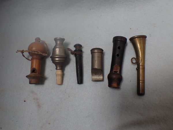 A COLLECTION OF WHISTLES /CALLS