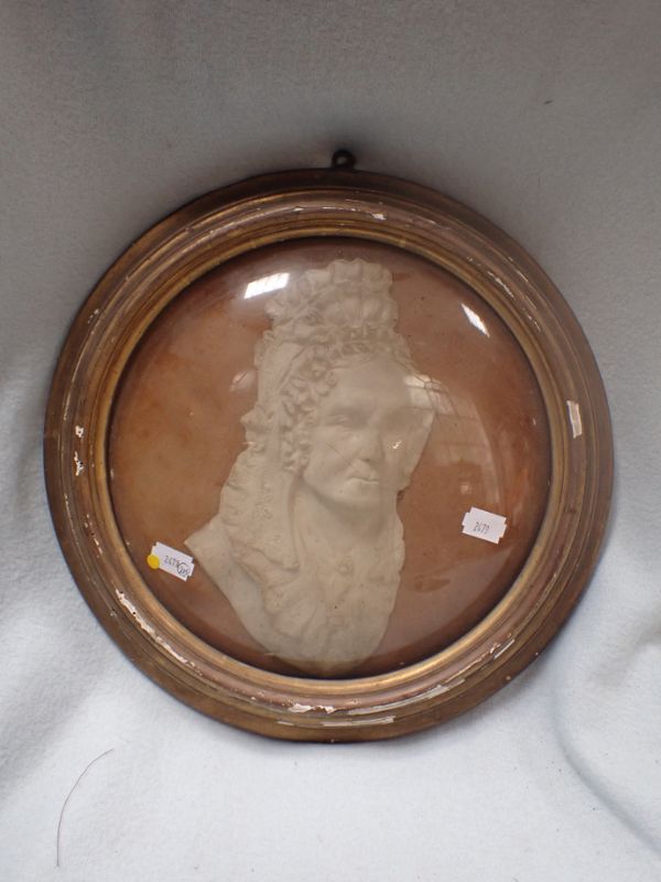 A FRAMED PLASTER RELIEF PORTRAIT