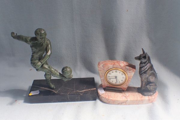 A PATINATED METAL FIGURE OF A FOOTBALLER