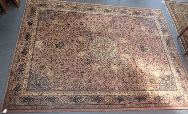 A PINK GROUND PERSIAN DESIGN ENGLISH CARPET