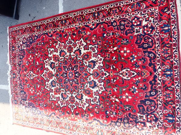 A LARGE RED GROUND PERSIAN DESIGN 'KAYAN' RUG