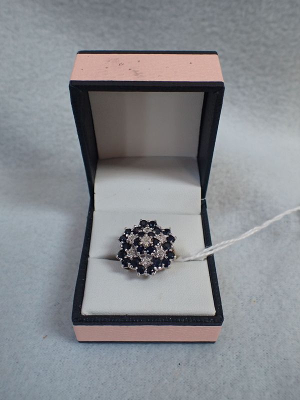 A GOLD DRESS RING FLOWER-SET WITH DIAMONDS