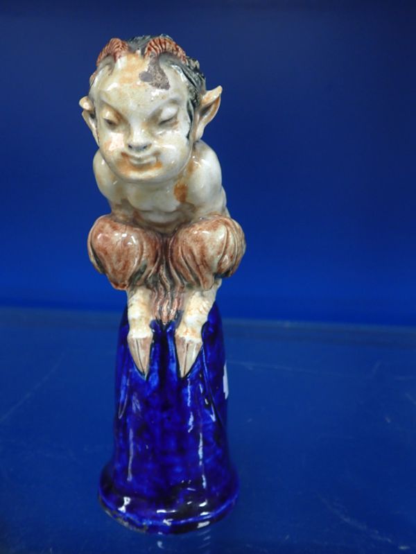 A GLAZED POLYCHROME STONEWARE FAWN