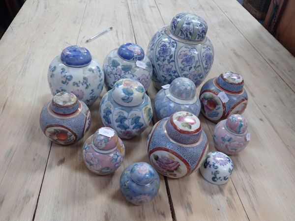 A COLLECTION OF BLUE AND PINK GINGER JARS