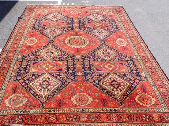 A PERSIAN STYLE ENGLISH RUG