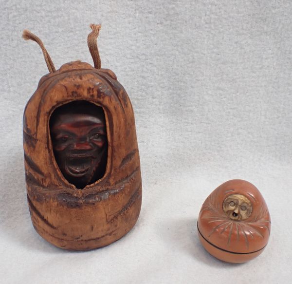 A CARVED OKIMONO TYPE HEAD