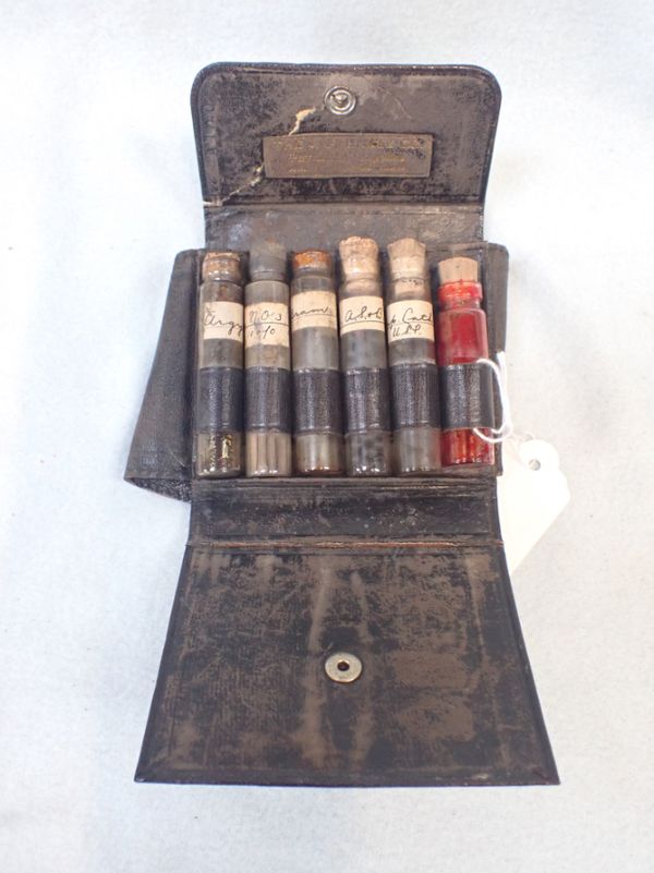 A TRAVELLING MADICINE BOTTLE CASE, WITH SOME CONTENTS