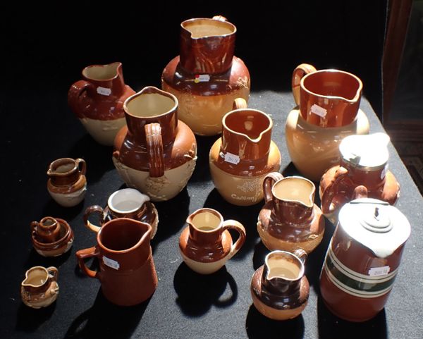 A COLLECTION OF STONEWARE MOULDED JUGS