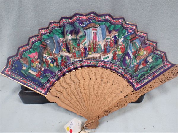 A CANTONESE FAN WITH CARVED GUARDS AND PAINTED WITH SCENES