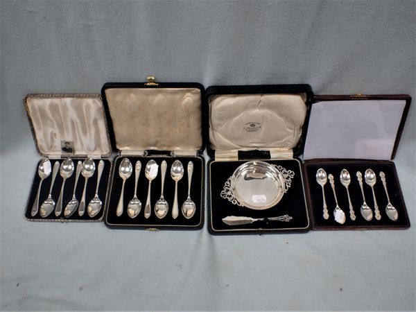 THREE CASED SETS OF SILVER TEASPOONS, AND A SILVER BUTTER DISH