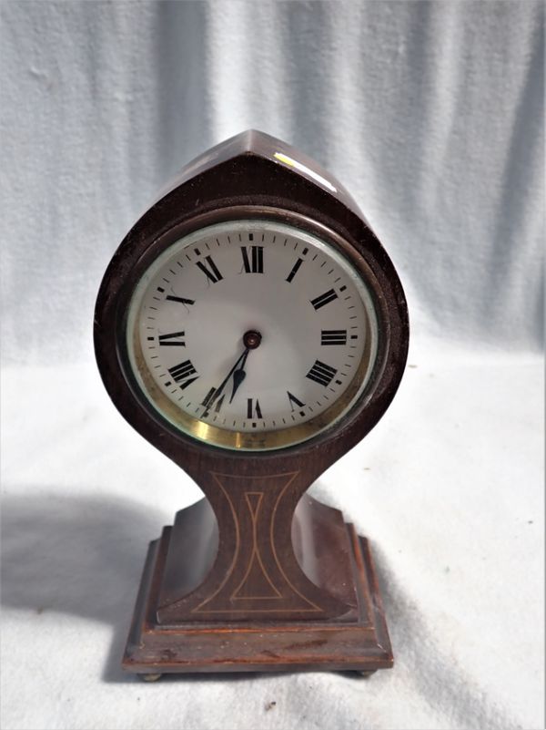 AN EDWARDIAN MAHOGANY CASED 'BALLOON' CLOCK