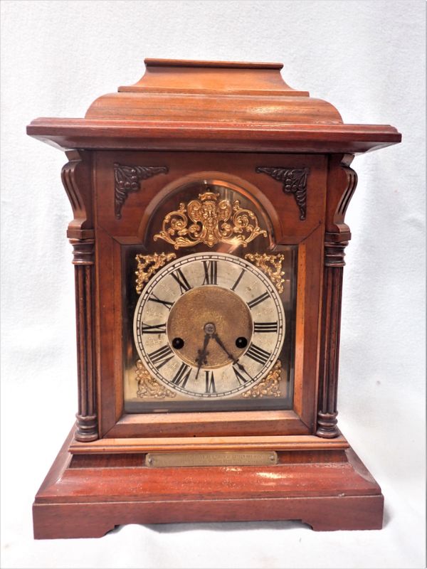 AN EDWARDIAN WALNUT CASED BRACKET CLOCK