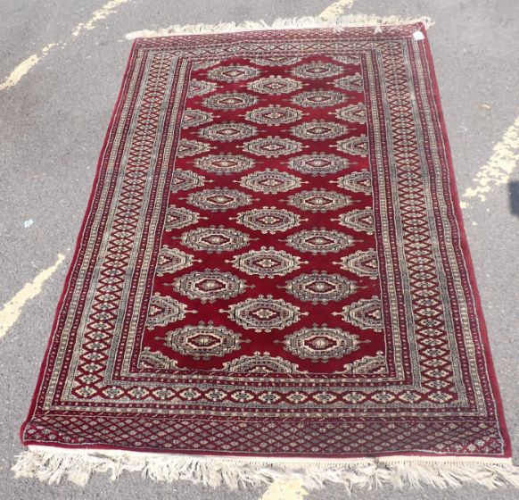 A RED GROUND TURKOMAN RUG