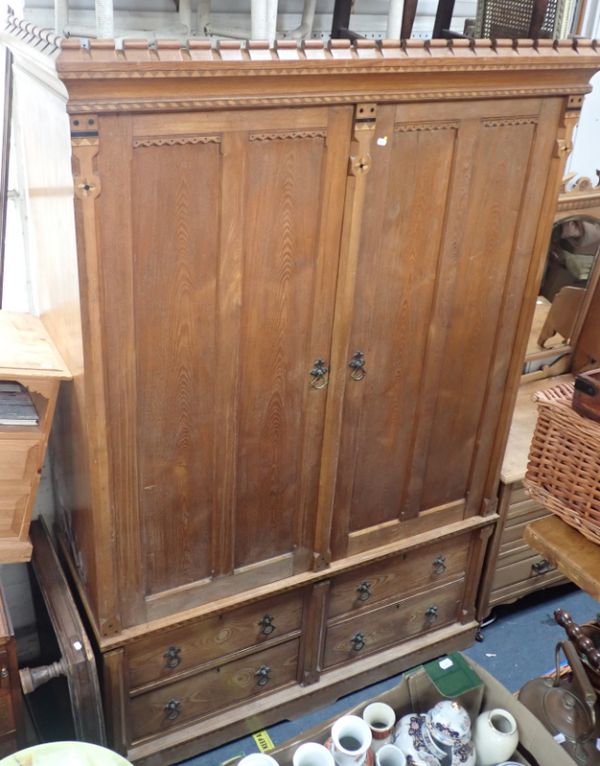 A 19TH CENTURY LIGHT OAK LINEN PRESS IN THE MANNER OF CHARLES BEVAN