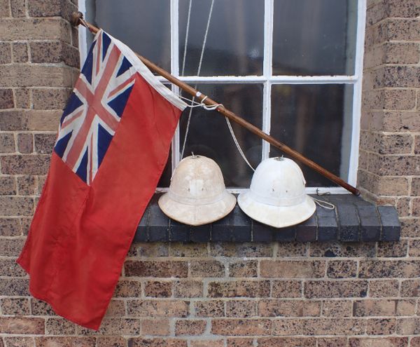 A RED ENSIGN ON AN ASH FLAGPOLE