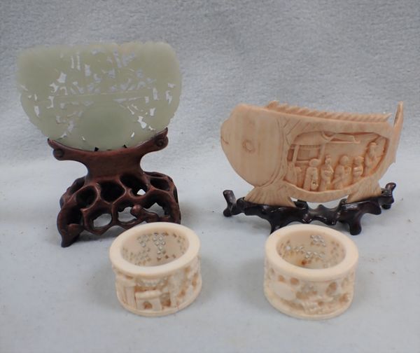 A SMALL CHINESE  JADE PLAQUE  ON A WOODEN STAND