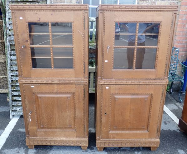 A PAIR OF CONTINENTAL OAK CABINETS