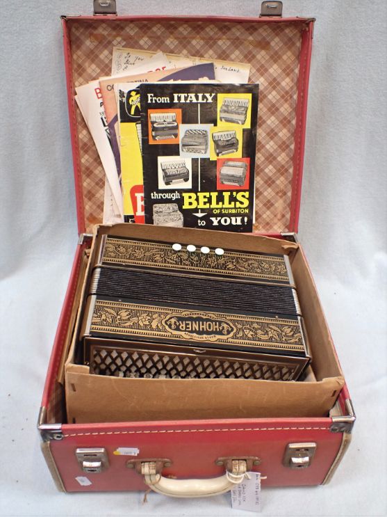 A HOHNER  ACCORDION, CASED