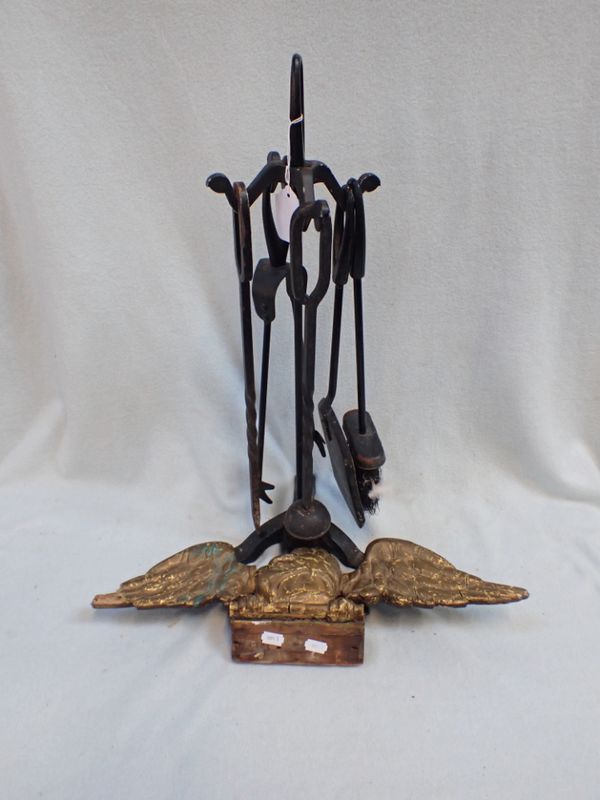 A SET OF FIRE IRONS AND A GILT GESSO EAGLE SURMOUNT