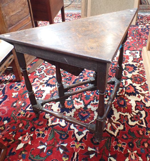 A 17TH CENTURY AND LATER  TRIANGULAR TABLE