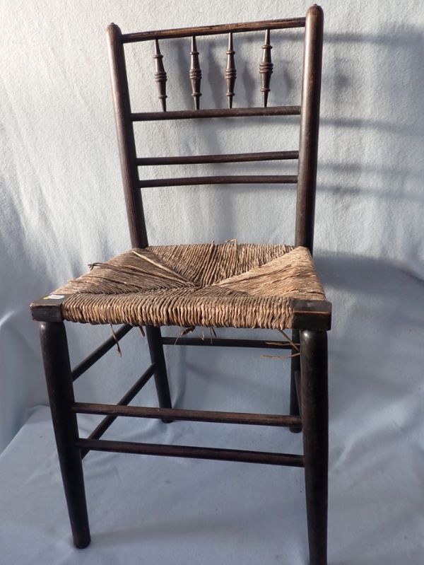 A 'SUSSEX' TYPE EBONISED ASH SINGLE CHAIR