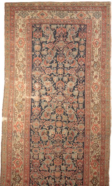 A DARK BLUE GROUND NORTH PERSIAN RUG