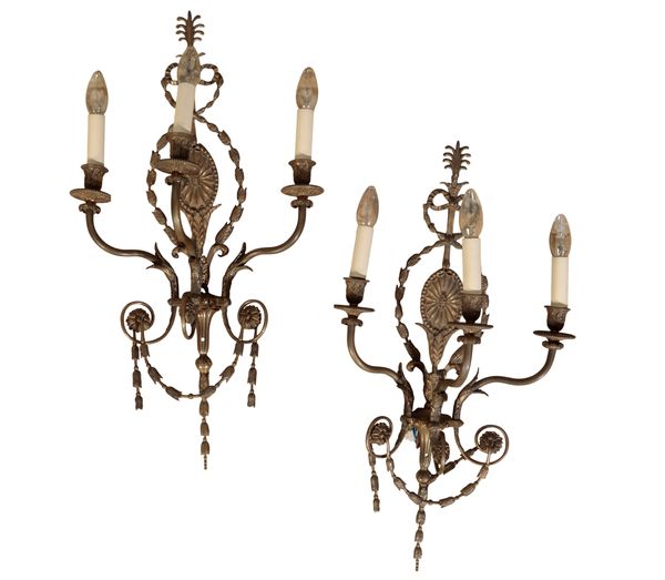 A PAIR OF REGENCY STYLE BRASS THREE LIGHT WALL APPLIQUES