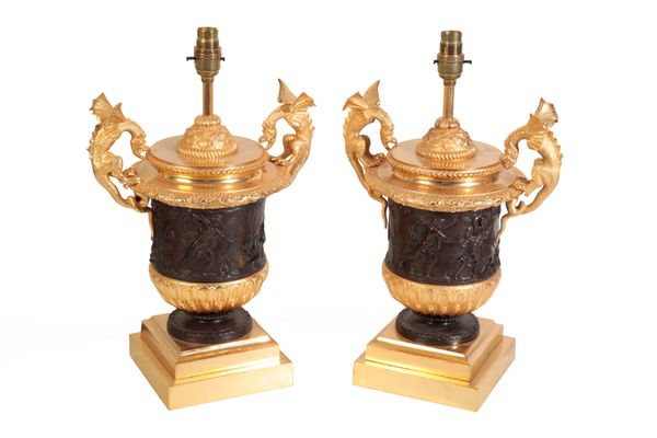 A PAIR OF BRONZE AND GILT METAL TABLE LAMPS IN EMPIRE STYLE